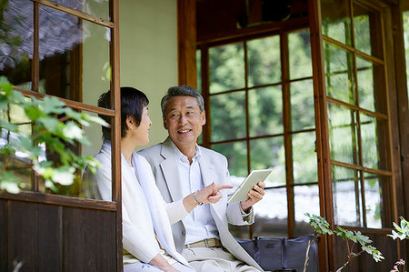 Japanese senior couple having fun at traditional inn Stock Photo - Premium Royalty-Free, Code: 622-09176159