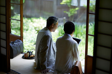 Japanese senior couple having fun at traditional inn Stock Photo - Premium Royalty-Free, Code: 622-09176161