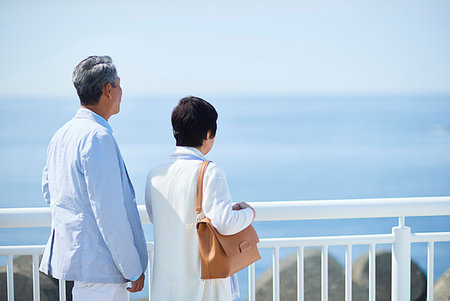 retired indian couple - Japanese senior couple having fun by the sea Stock Photo - Premium Royalty-Free, Code: 622-09176340