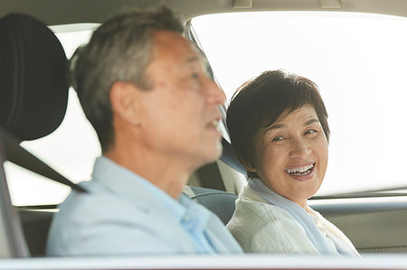 Japanese senior couple driving Stock Photo - Premium Royalty-Free, Code: 622-09176399