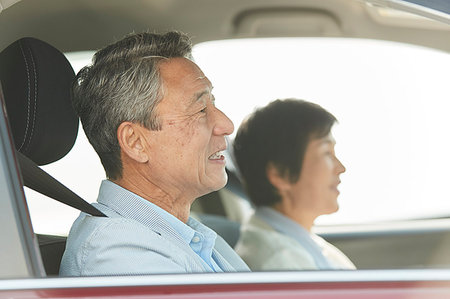 Japanese senior couple driving Stock Photo - Premium Royalty-Free, Code: 622-09176402