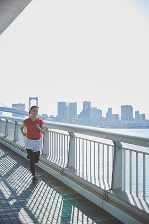 skewed - Young Japanese woman training downtown Tokyo Stock Photo - Premium Royalty-Free, Code: 622-09176460