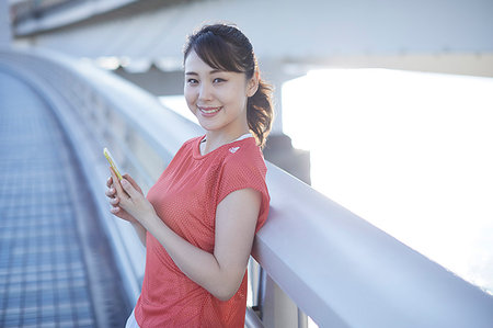 Young Japanese woman training downtown Tokyo Stock Photo - Premium Royalty-Free, Code: 622-09176475