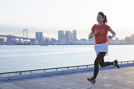 skewed - Young Japanese woman training downtown Tokyo Stock Photo - Premium Royalty-Free, Code: 622-09176486