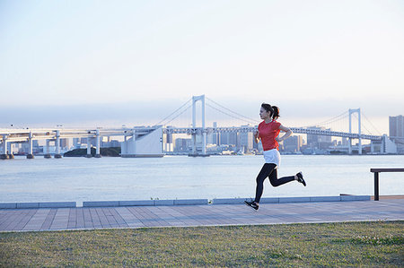 shorts athletic wear - Young Japanese woman training downtown Tokyo Stock Photo - Premium Royalty-Free, Code: 622-09176487