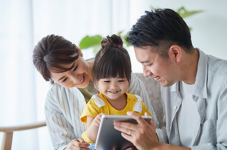 simsearch:859-09193167,k - Japanese family on the sofa Stock Photo - Premium Royalty-Free, Code: 622-09187509