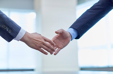 Japanese businesspeople shaking hands Stock Photo - Premium Royalty-Free, Code: 622-09180855