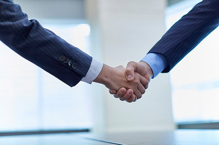 Japanese businesspeople shaking hands Stock Photo - Premium Royalty-Free, Code: 622-09180857