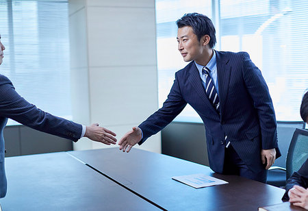 Japanese businesspeople shaking hands Stock Photo - Premium Royalty-Free, Code: 622-09180859