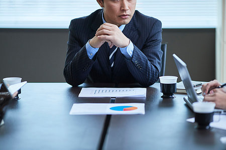 Japanese businesspeople in a meeting Stock Photo - Premium Royalty-Free, Code: 622-09181145