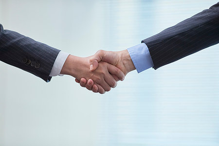 Japanese businesspeople shaking hands Stock Photo - Premium Royalty-Free, Code: 622-09181204