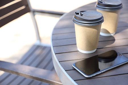 paper cup on table - Coffee Stock Photo - Premium Royalty-Free, Code: 622-09194923