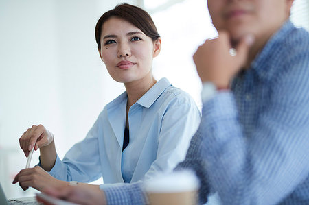 Japanese business people at work Stock Photo - Premium Royalty-Free, Code: 622-09195187