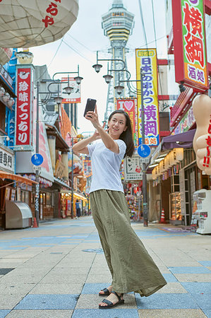 stores in outdoor mall - Young Japanese woman in Osaka Stock Photo - Premium Royalty-Free, Code: 622-09235862