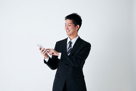 dar toques - Young Japanese businessman Foto de stock - Sin royalties Premium, Código: 622-09236190