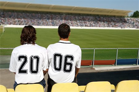 soccer fans in stadium - Two soccer friends wearing 2006 on their shirts Stock Photo - Premium Royalty-Free, Code: 622-00701669