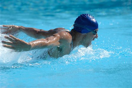 professional swimmer - Male Swimmer Swimming Butterfly Stock Photo - Premium Royalty-Free, Code: 622-00806887