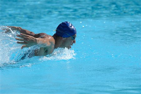 professional swimmer - Male Swimmer Swimming Butterfly Stock Photo - Premium Royalty-Free, Code: 622-00806889