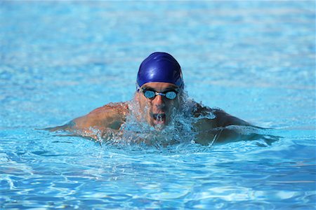 professional swimmer - Male Swimmer Swimming Butterfly Stock Photo - Premium Royalty-Free, Code: 622-00806898