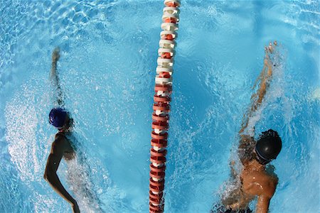 professional swimmer - Male and Female Swimmer Racing Stock Photo - Premium Royalty-Free, Code: 622-00806904