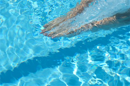 Hands of Male Swimmer Gliding Underwater Stock Photo - Premium Royalty-Free, Code: 622-00806926