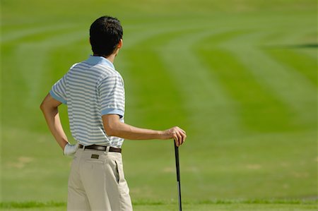 Male golfer contemplating his shot Stock Photo - Premium Royalty-Free, Code: 622-00807002
