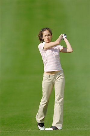 simsearch:622-01283759,k - Woman watching her golf shot Foto de stock - Sin royalties Premium, Código: 622-00807015