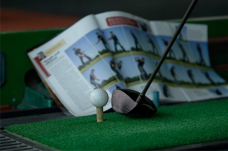 Close up of a golf ball, a golf club and a golf magazine Foto de stock - Sin royalties Premium, Código: 622-00807129