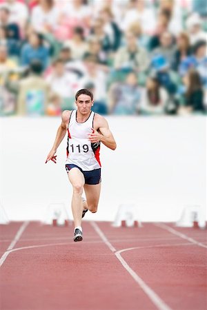 simsearch:622-00947146,k - Male Runner Sprinting Down a Track Stock Photo - Premium Royalty-Free, Code: 622-00947143