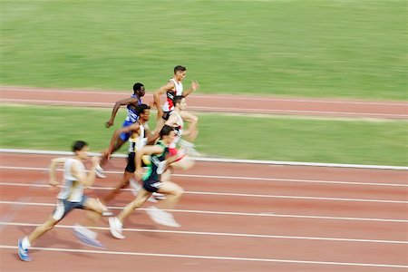 simsearch:622-00947146,k - Male Runners Sprinting Down Track Stock Photo - Premium Royalty-Free, Code: 622-00947165