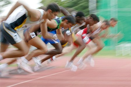 simsearch:622-00947146,k - Male Runners Leaping Off Starting Blocks Stock Photo - Premium Royalty-Free, Code: 622-00947169