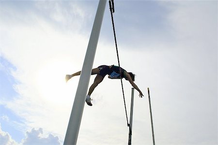 Man Pole Vaulting Foto de stock - Royalty Free Premium, Número: 622-00947198