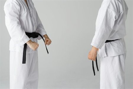 sparring - Two Blackbelts Sparring Fotografie stock - Premium Royalty-Free, Codice: 622-00947244