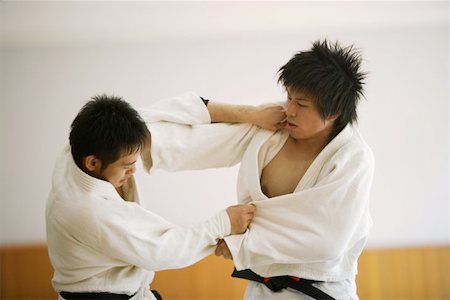 drilling (activity) - Deux hommes en compétition dans un Match de Judo Photographie de stock - Premium Libres de Droits, Code: 622-00947276