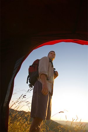 Hiker viewed from tent Stock Photo - Premium Royalty-Free, Code: 622-01080644