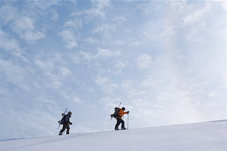 pictures of man snowshoeing - Two snowboarders trudging through snow Stock Photo - Premium Royalty-Free, Code: 622-01098746