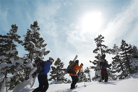 Three snowboarders walking through snow Foto de stock - Sin royalties Premium, Código: 622-01098747