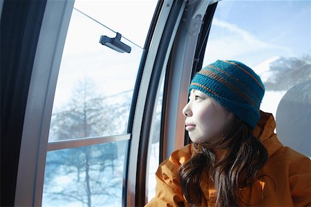 female asian snowboarders - Asian female snowboarder in ski lift Stock Photo - Premium Royalty-Free, Code: 622-01098753