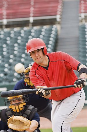 simsearch:622-01283759,k - Baseball player bunting the ball Foto de stock - Sin royalties Premium, Código: 622-01283697