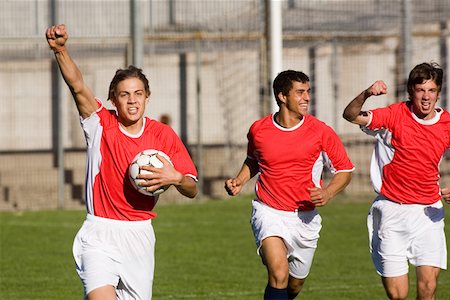 football team celebration - Joueurs de football célébrant Photographie de stock - Premium Libres de Droits, Code: 622-01283706