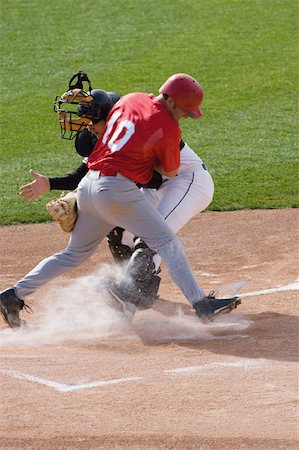 Joueur de baseball charge home plate Photographie de stock - Premium Libres de Droits, Code: 622-01283754