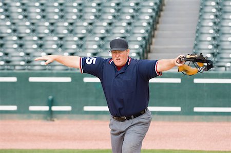 Umpire calling safe Foto de stock - Sin royalties Premium, Código: 622-01283760