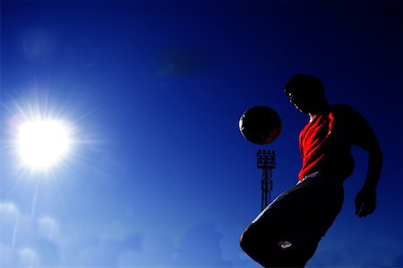 simsearch:622-01283855,k - Boy juggling a ball in the sunshine Stock Photo - Premium Royalty-Free, Code: 622-01283804