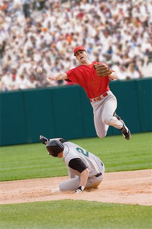 pitcher and baseball - Going for a double play Stock Photo - Premium Royalty-Free, Code: 622-01283840