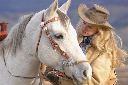 Cowgirl and her Horse Stock Photo - Premium Royalty-Free, Code: 622-01572156