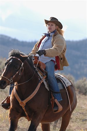 Cowgirl On her Horse Stock Photo - Premium Royalty-Free, Code: 622-01572198