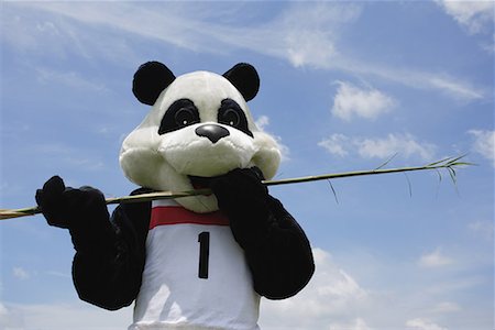 funny bear olympic - Panda Eating a Bamboo Shoot Stock Photo - Premium Royalty-Free, Code: 622-01572278