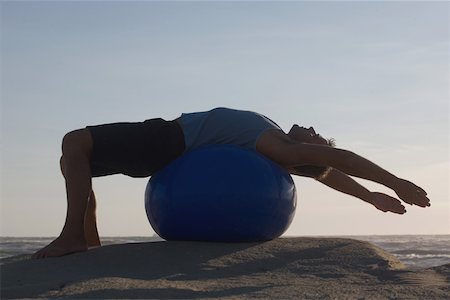Man Excersizing on a Ball Stock Photo - Premium Royalty-Free, Code: 622-01572303
