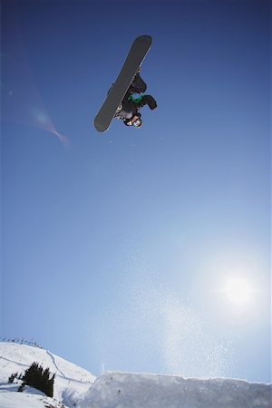 simsearch:622-01695701,k - Snowboarder Flying Through the Air Fotografie stock - Premium Royalty-Free, Codice: 622-01695684