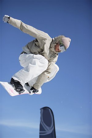 simsearch:622-01695701,k - Snowboarder Juping a Barrier Fotografie stock - Premium Royalty-Free, Codice: 622-01695691